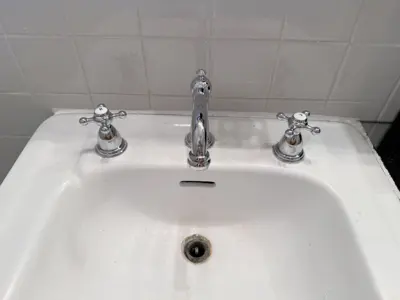 Faucet replacement — old faucet removed, new one installed