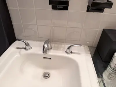 Faucet replacement — old faucet removed, new one installed