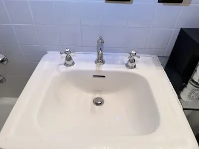 Faucet replacement — old faucet removed, new one installed