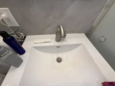 Faucet replacement — old faucet removed, new one installed