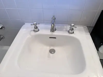 Faucet replacement — old faucet removed, new one installed