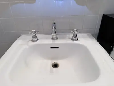 Faucet replacement — old faucet removed, new one installed