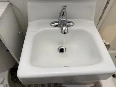 Faucet replacement — old faucet removed, new one installed