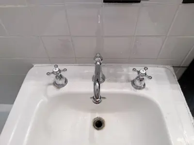 Faucet replacement — old faucet removed, new one installed