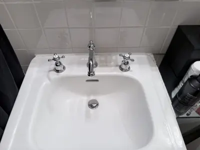 Faucet replacement — old faucet removed, new one installed