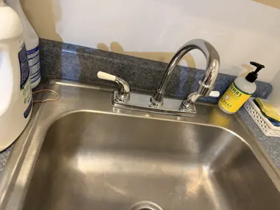 New faucet installation with plumbing connection