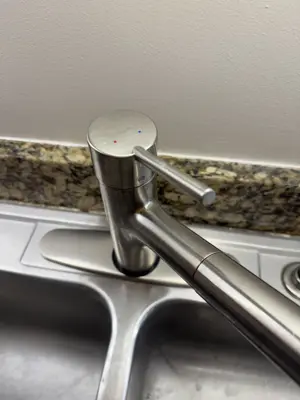 Faucet replacement — old faucet removed, new one installed