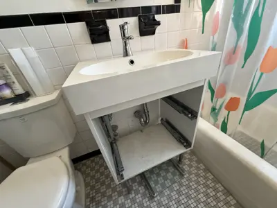 Sink and vanity installation in a NYC bathroom