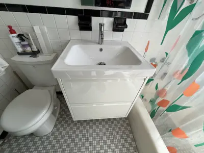 Sink and vanity installation in a NYC bathroom