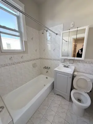 Sink and vanity installation in a NYC bathroom