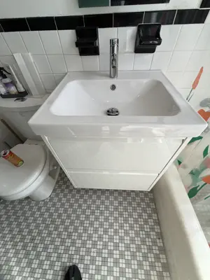 Sink and vanity installation in a NYC bathroom