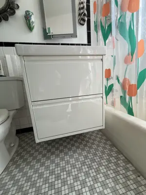 Sink and vanity installation in a NYC bathroom