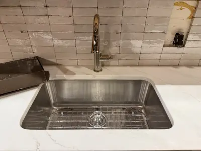 Sink and vanity installation in a NYC bathroom