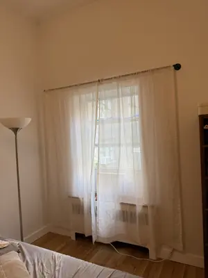 Curtain rod installation with window treatment hardware