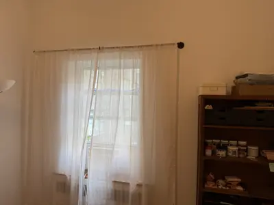 Curtain rod installation with window treatment hardware