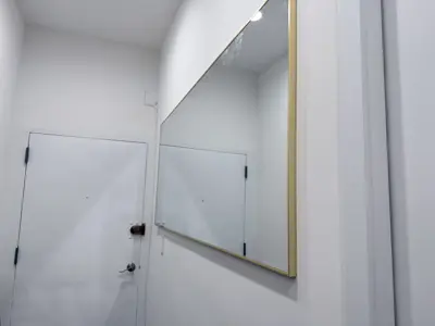 Mirror installation — wall-mounted with secure anchoring