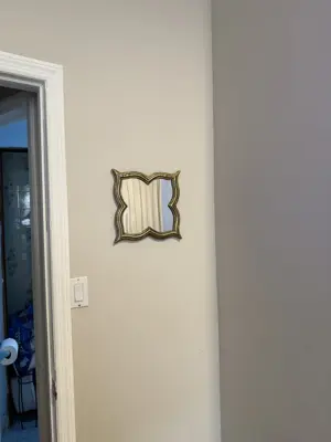 Mirror installation — wall-mounted with secure anchoring