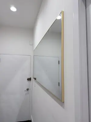 Mirror installation — wall-mounted with secure anchoring