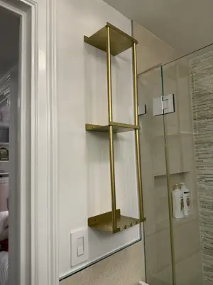 Floating shelf installation on apartment wall
