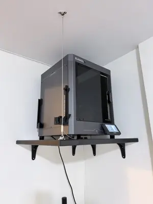 Floating shelf installation on apartment wall