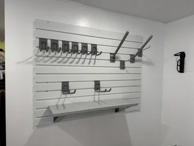 Floating shelf installation on apartment wall