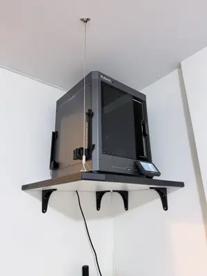 Floating shelf installation on apartment wall