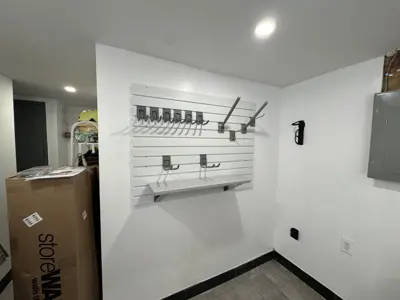 Floating shelf installation on apartment wall
