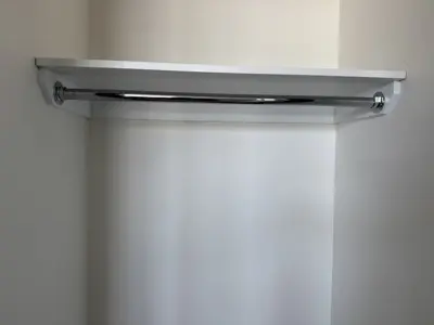 Floating shelf installation on apartment wall