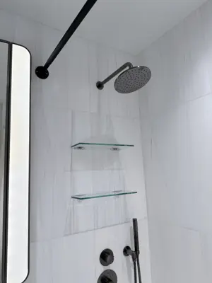 Floating shelf installation on apartment wall