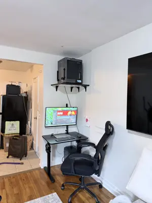 Floating shelf installation on apartment wall