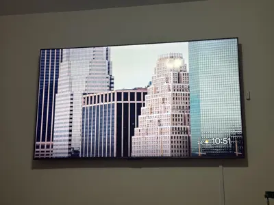 TV wall mounting — flat screen mounted with bracket and cable management